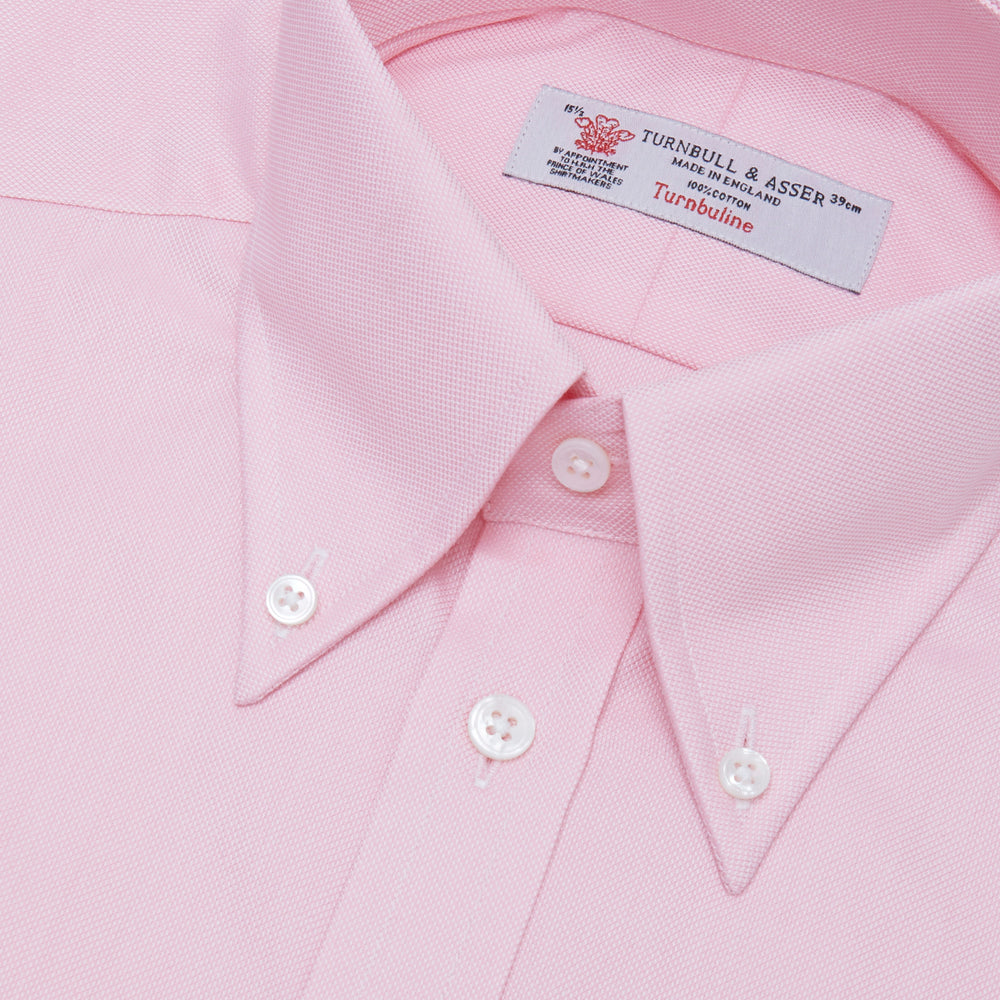 The Turnbull & Asser Pink Royal Oxford Cotton Shirt features a button-down collar and 3-button cuffs, ideal for men's weekend wear. Displayed against a plain white background.