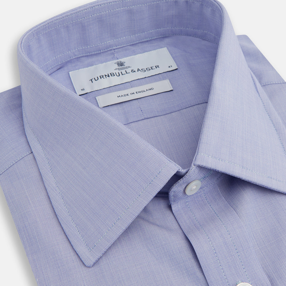 The Turnbull & Asser Blue End-on-End Cotton Shirt features a T&A collar and 3-button cuffs, perfect for pairing with a navy suit or smart ensemble, and is displayed flat against a white background.