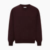 View 6 of product The Turnbull & Asser Burgundy Fine Merino V-Neck Jumper features a classic plain knit design with long sleeves, showcased against a crisp white background.