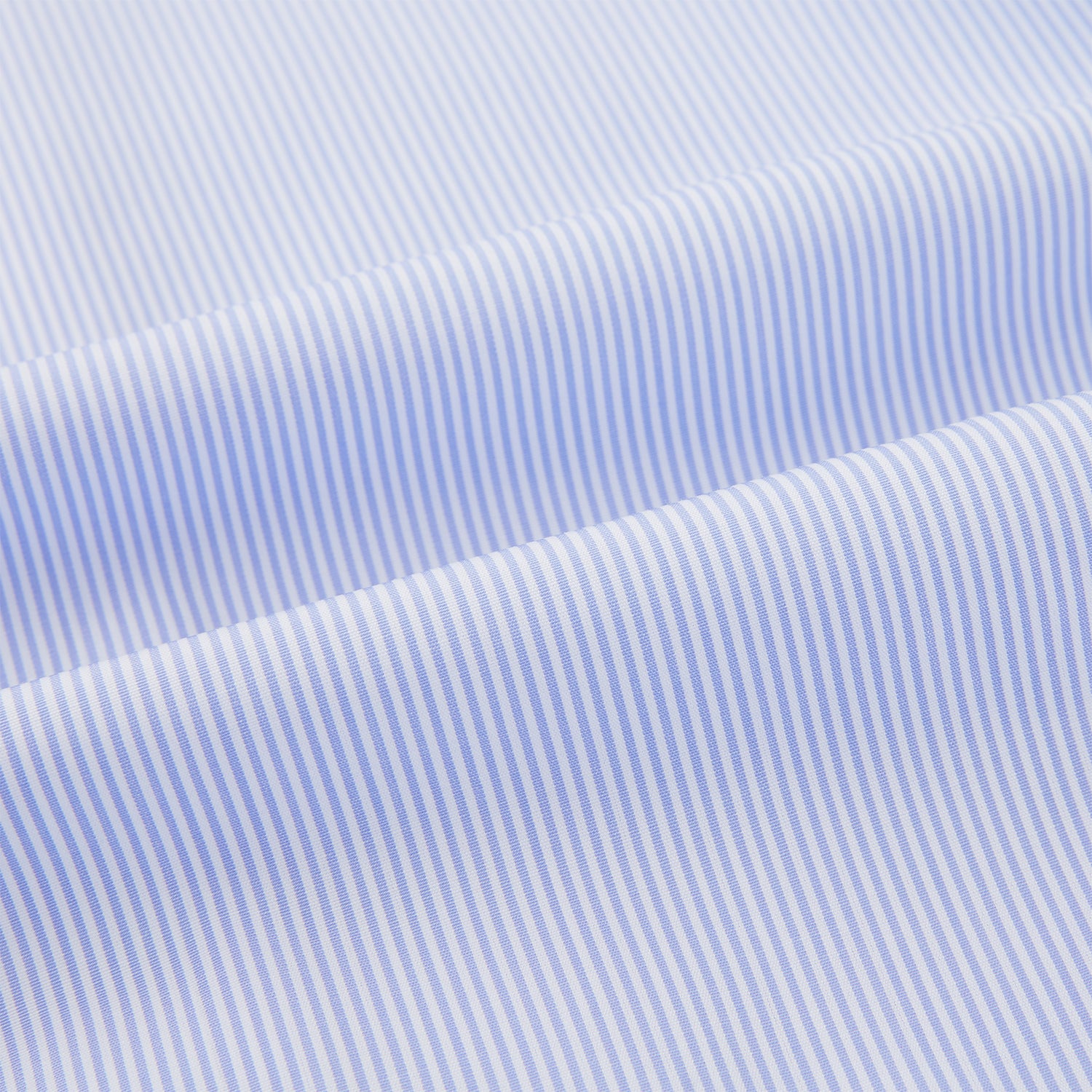 View 6 of product The Turnbull & Asser Pale Blue Hairline Stripe Pyjama Shirt features long sleeves and a single chest pocket, offering an elegant sleepwear style—shown on a plain white background.