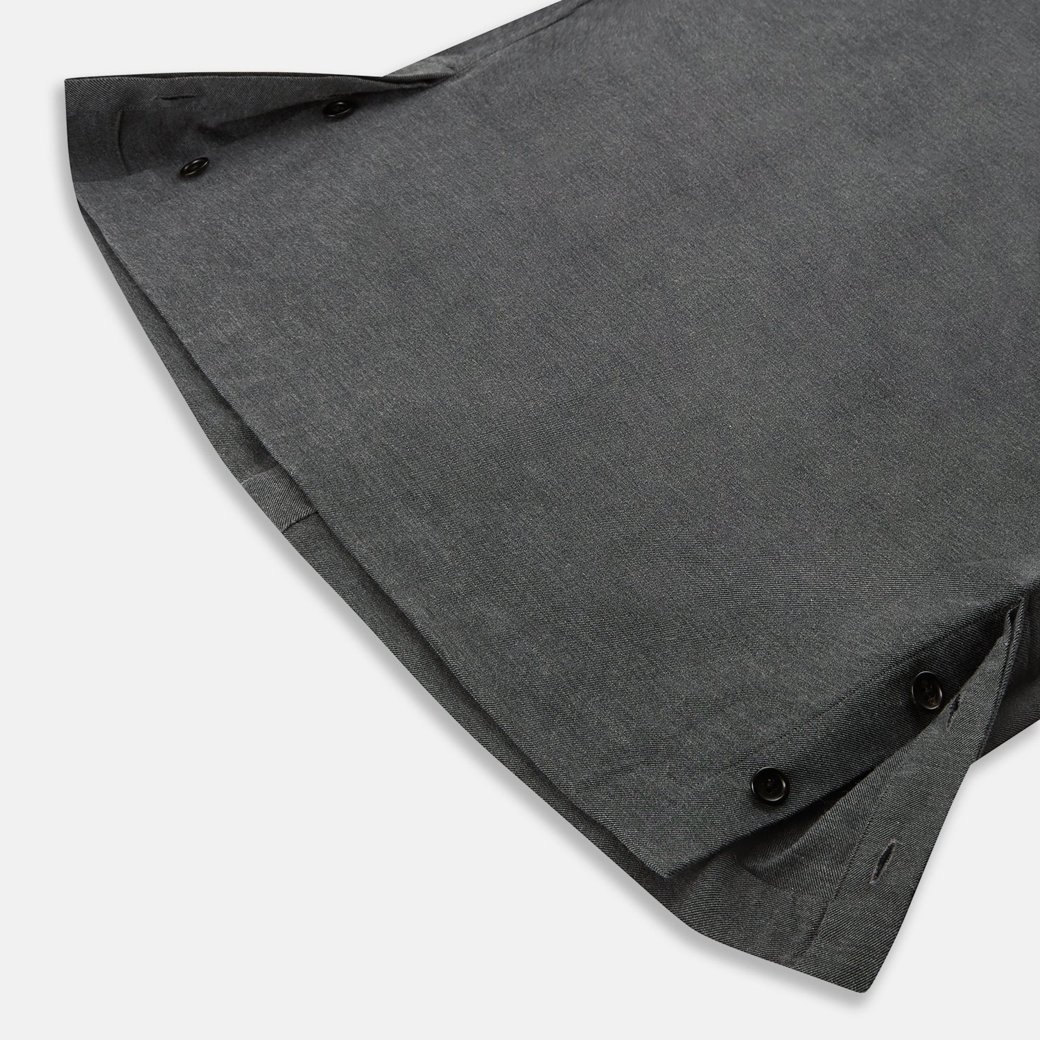 View 5 of product The Charcoal Melange Hampstead overshirt by Turnbull & Asser is a dark gray long-sleeve button-up with a collar, left chest pocket, and two zippered side pockets, shown laid flat on a white background.