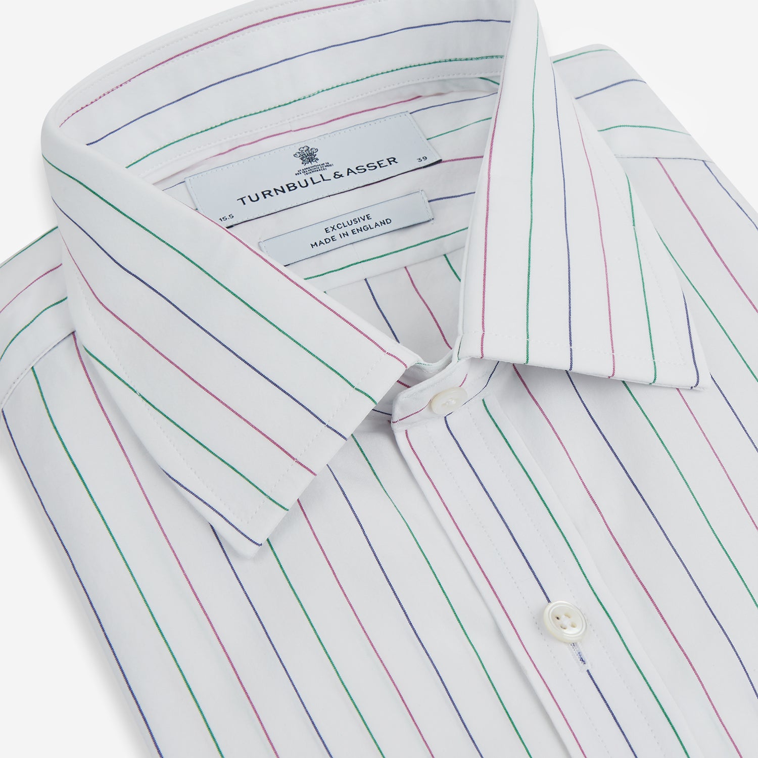View 2 of product The Turnbull & Asser Pink and Green Wide Pinstripe Mayfair Shirt is a long-sleeve, button-up shirt made from organic cotton, shown laid flat on a white background.