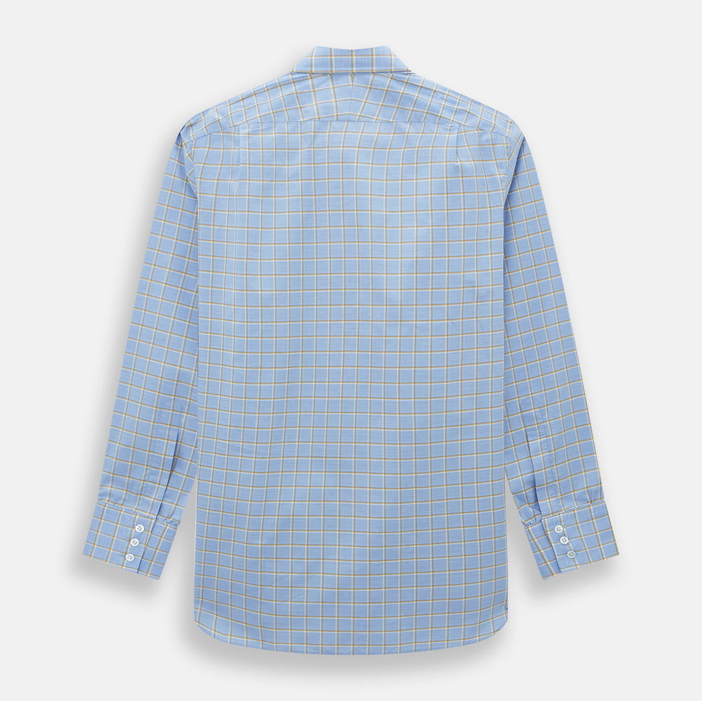 The Turnbull & Asser Blue and Yellow Windowpane Mayfair Shirt is crafted from fine Italian cotton, featuring a light blue base with yellow and white checks, shown on a plain white background.