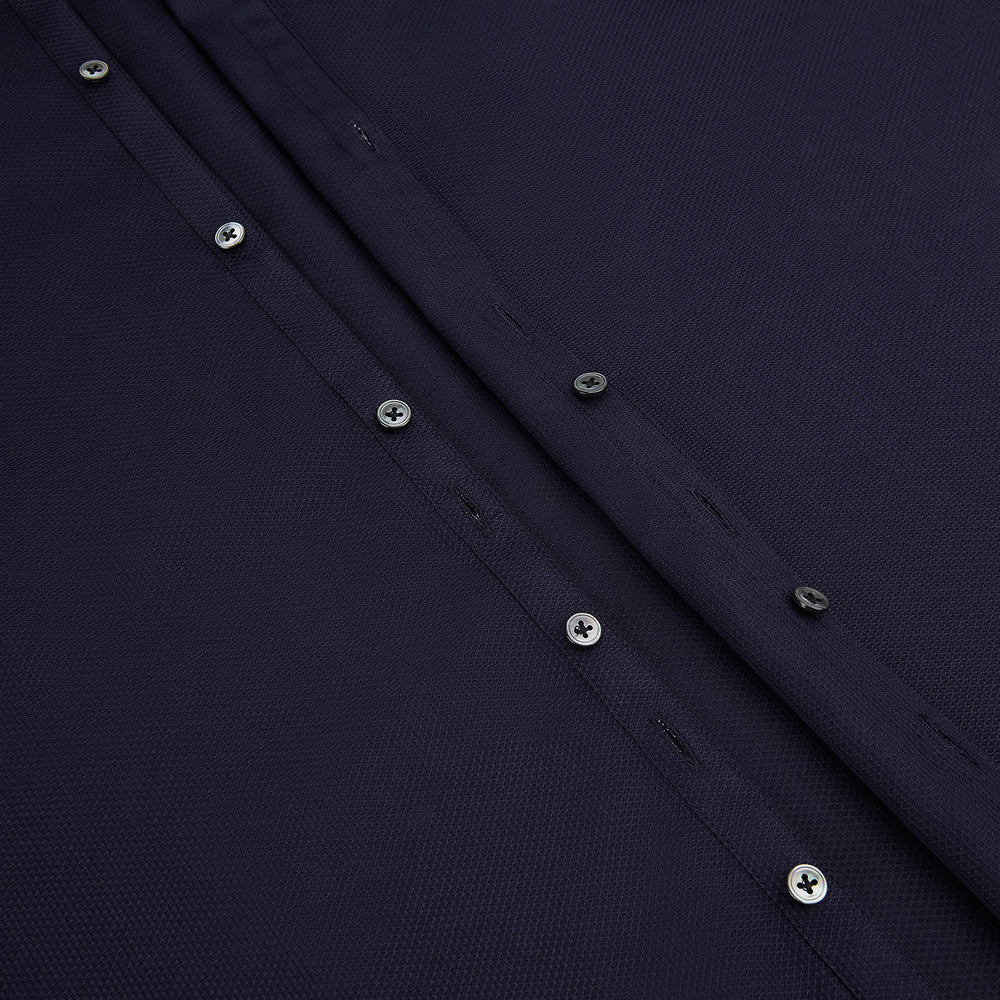 The Navy Textured Windsor Shirt by Turnbull & Asser features long sleeves, a Windsor collar, buttoned cuffs, and white buttons—a fine example of British craftsmanship—set against a plain white background.