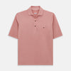View 1 of product The Turnbull & Asser Red Polo Shirt is a men's cotton polo with short sleeves, a collar, a three-button neckline, and a buttoned chest pocket. The shirt is shown laid flat on a white background.