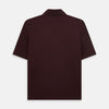 View 3 of product The Turnbull & Asser Burgundy Polo Shirt is crafted from soft cotton jersey with short sleeves, a classic collar, three front buttons, and a small buttoned chest pocket, shown flat on a white background.