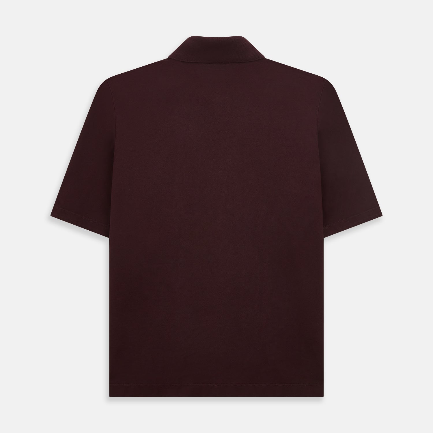 View 3 of product The Turnbull & Asser Burgundy Polo Shirt is crafted from soft cotton jersey with short sleeves, a classic collar, three front buttons, and a small buttoned chest pocket, shown flat on a white background.