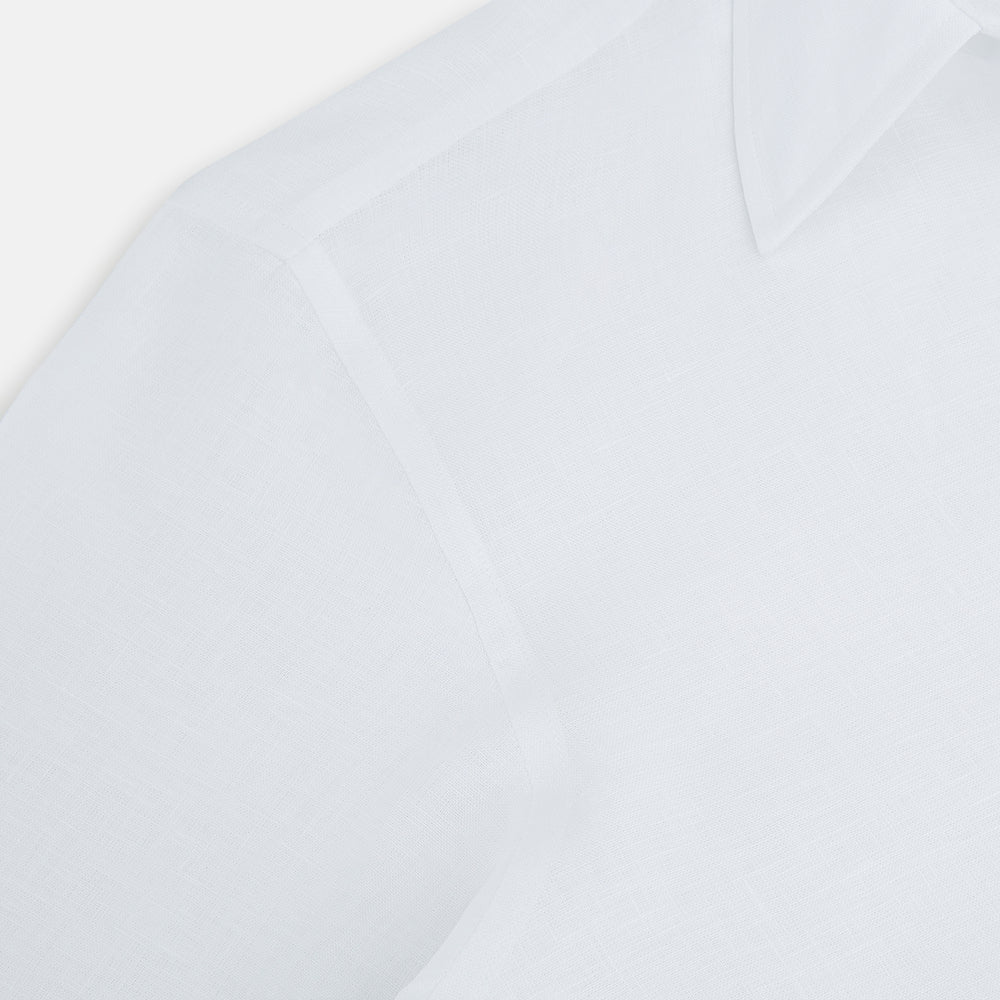 The White Linen Westminster Shirt by Turnbull & Asser features a classic Turnbull collar and button-down front, highlighting British craftsmanship against a plain white background.