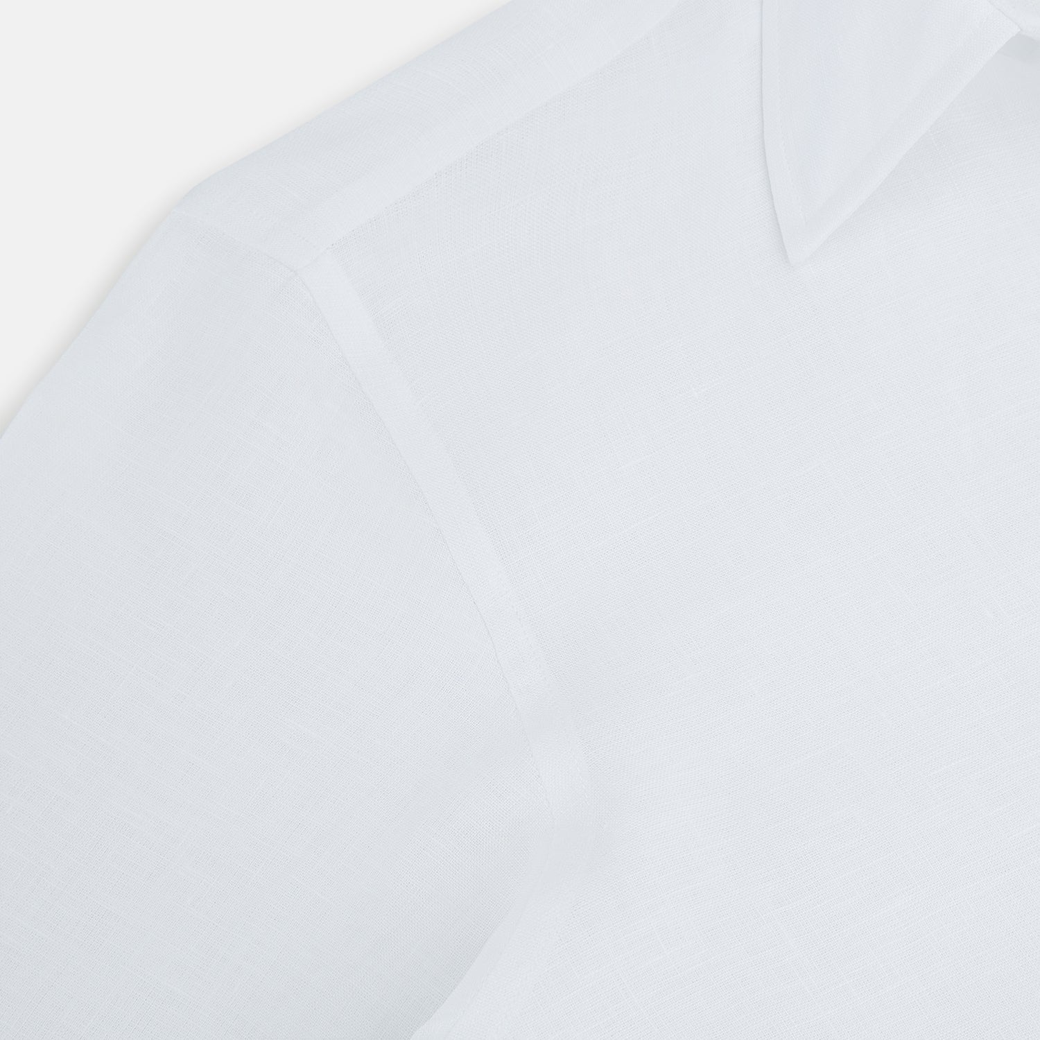 View 6 of product The White Linen Westminster Shirt by Turnbull & Asser features a classic Turnbull collar and button-down front, highlighting British craftsmanship against a plain white background.