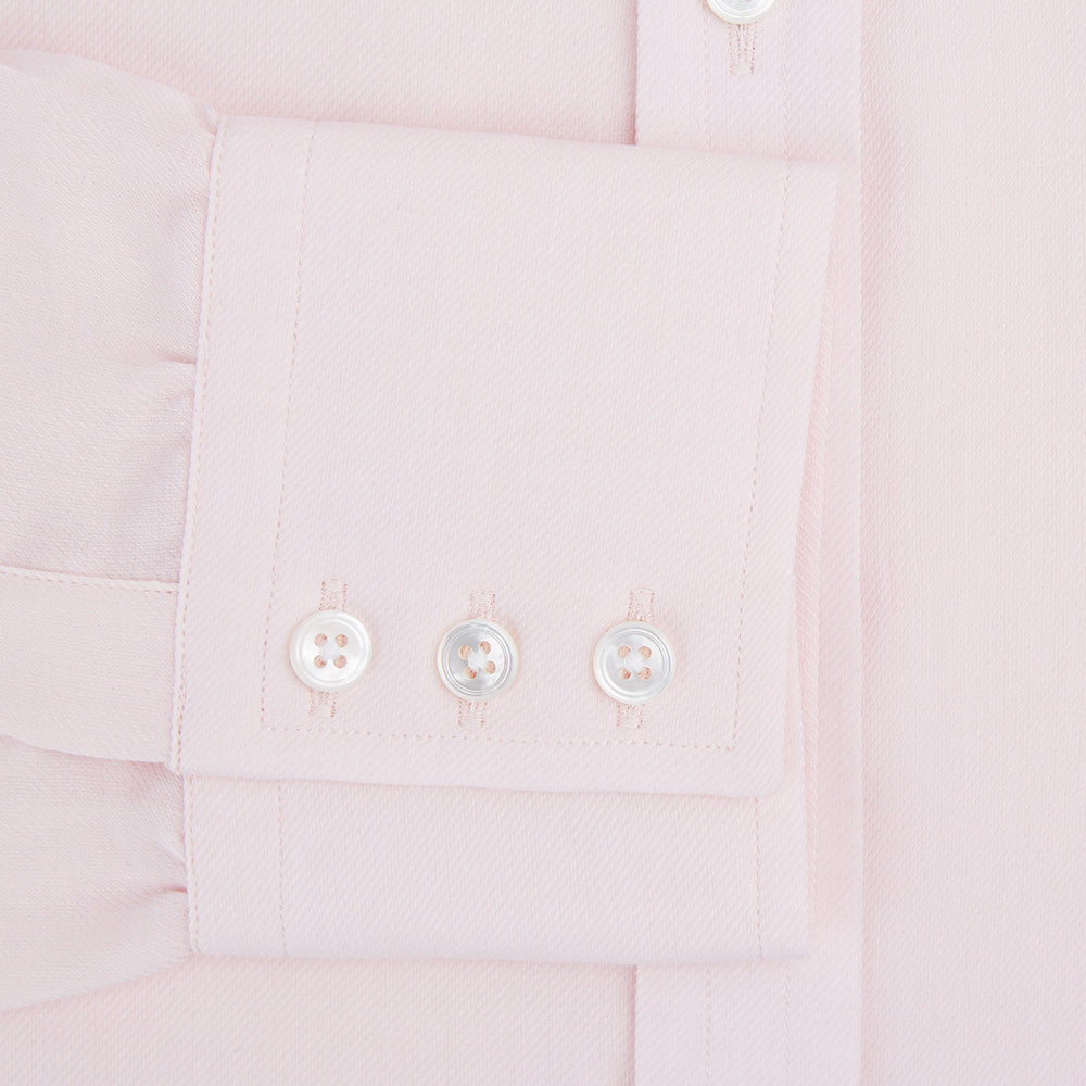 The Pale Pink Cotton Cashmere Mayfair Shirt by Turnbull & Asser features a classic collar, button-down front, and buttoned cuffs, crafted from a luxurious cotton-cashmere blend and displayed flat on a white background.