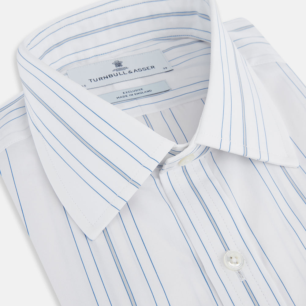 The Turnbull & Asser Pale Blue Multi Stripe Mayfair Shirt, featuring long sleeves, a classic collar, and buttoned cuffs, exemplifies British craftsmanship and is shown flat on a white background for a crisp look.