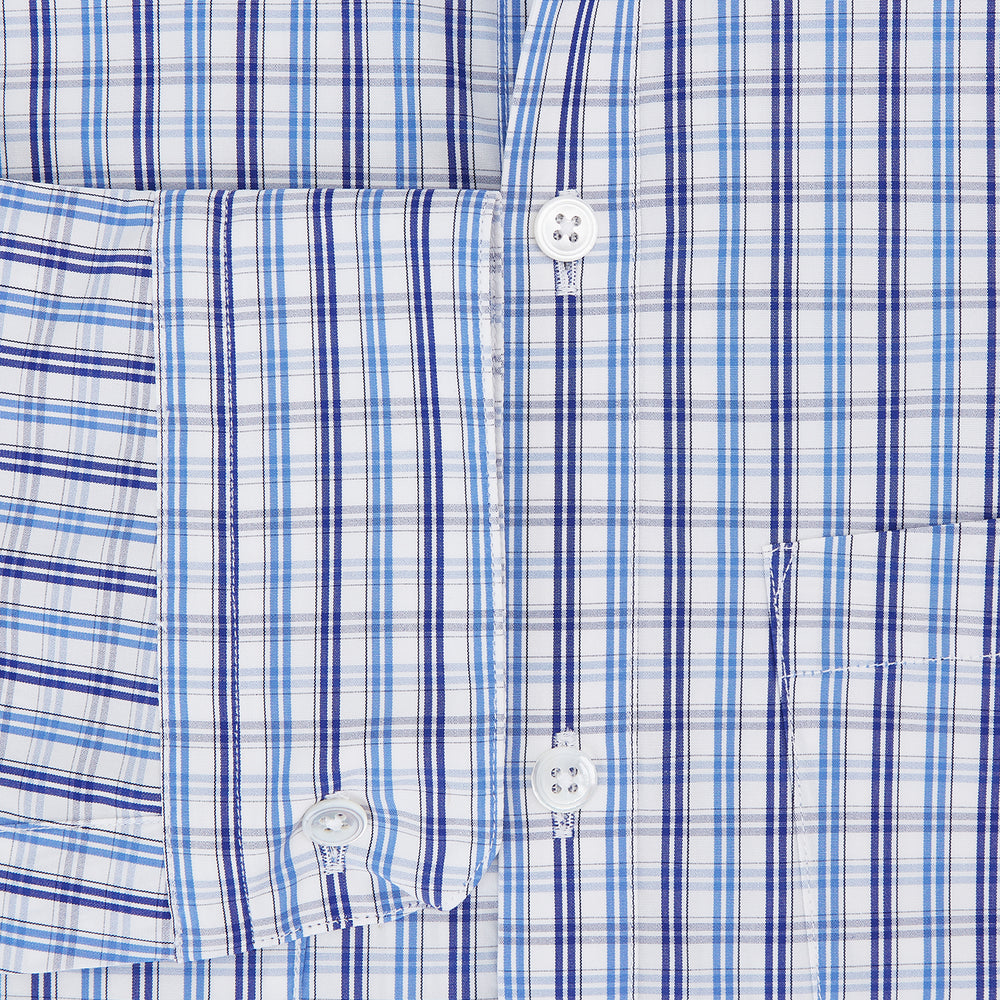 Turnbull & Asser's Blue and Navy Multi Check Piccadilly Shirt features long sleeves, a pointed collar, and two buttoned chest pockets, shown on a white background.