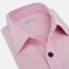 View 2 of product The Pink Hyde Overshirt by Turnbull & Asser is a long-sleeved, light pink sanforised cotton shirt with a left chest pocket and dark buttons—an elegant, laid-back alternative to a blazer.