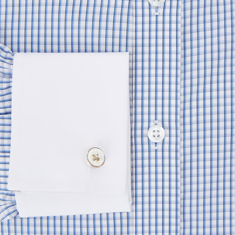 The Turnbull & Asser Sky Blue Micro Shadow Check Shirt features a Mayfair fit, contrast white collar and double cuffs—ideal for formal wear—shown against a plain white background.