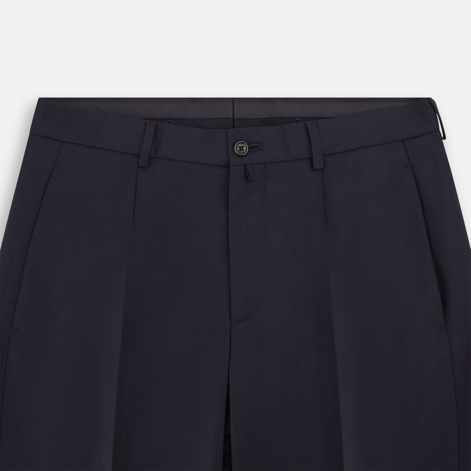 View 2 of product The Navy Rupert Trousers by Turnbull & Asser are tailored wool trousers with a button and zip closure, belt loops, and front creases, elegantly displayed against a plain white background.