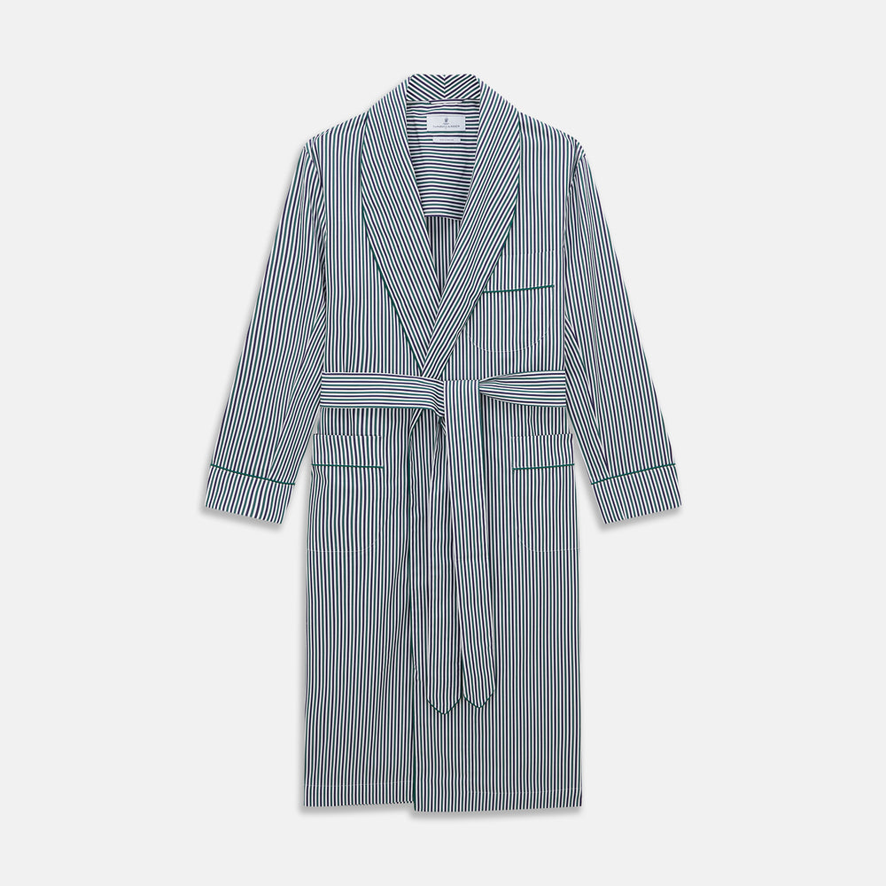 The Turnbull & Asser Green and Blue Stripe Cotton Arnold Gown features long sleeves, a knee-length cut, a shawl collar, front pockets, and an elegant wrap belt at the waist.
