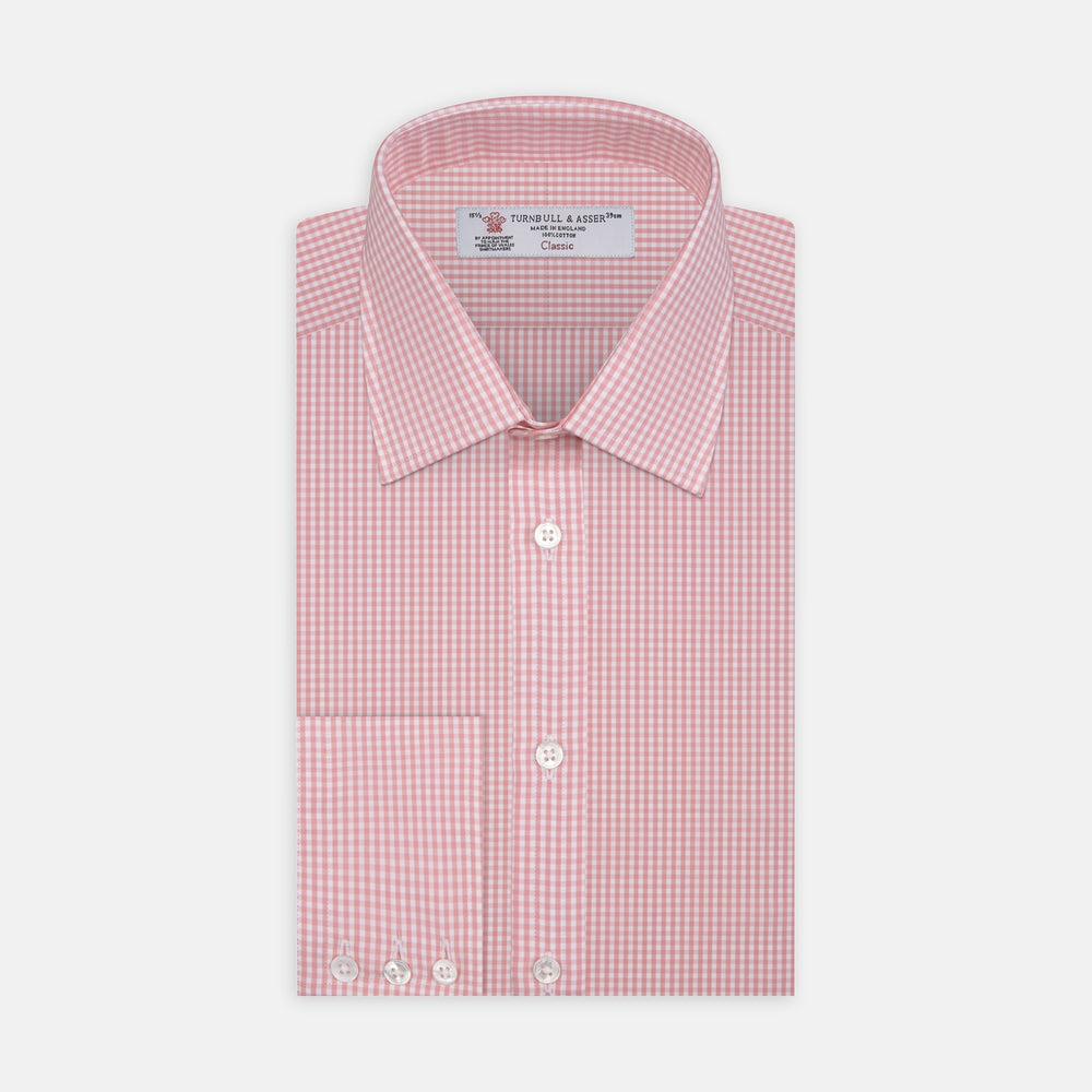 The Turnbull & Asser Light Pink Gingham Check Shirt features a classic T&A collar, 3-button cuffs, and white buttons, neatly folded on a plain white background.