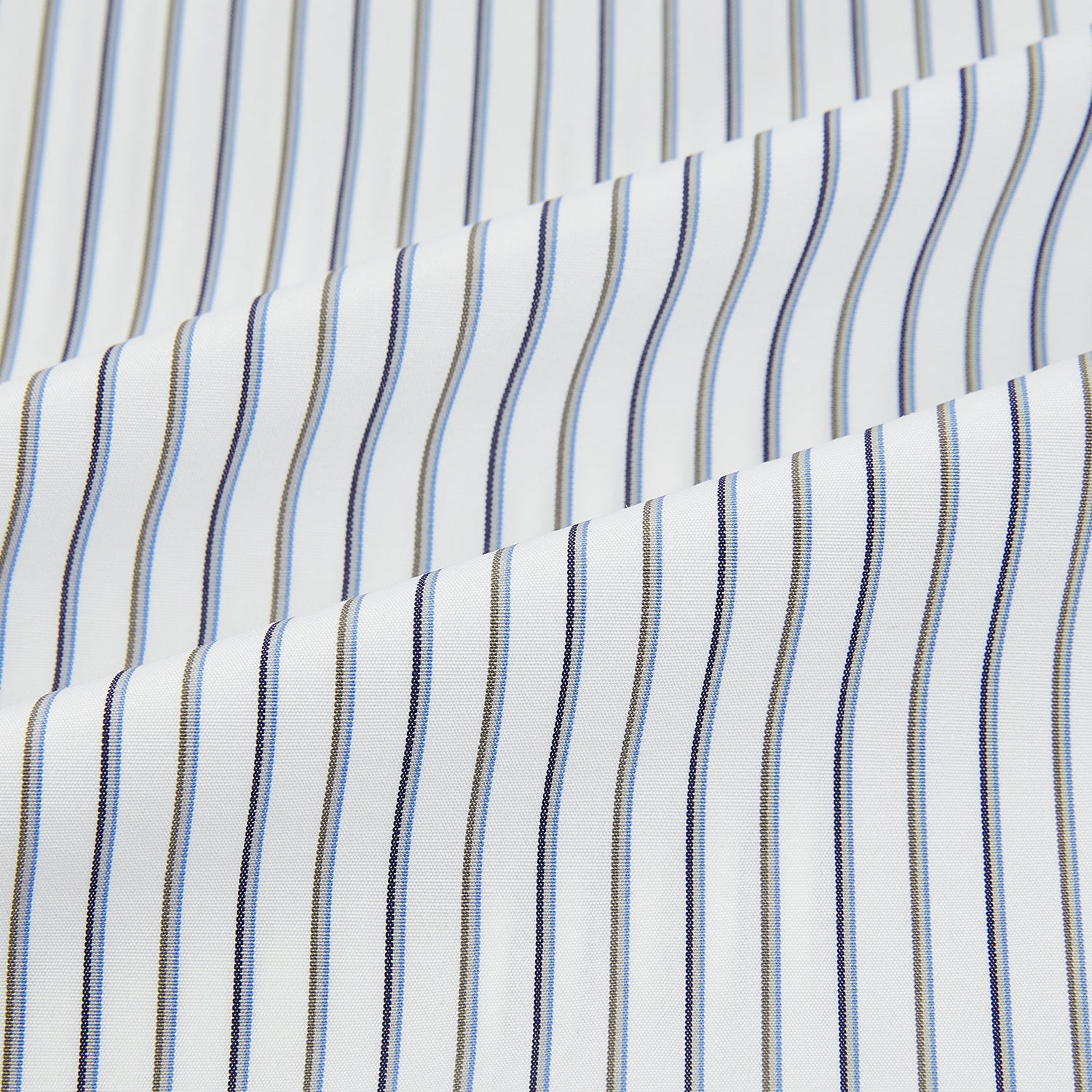 View 6 of product The Turnbull & Asser Brown and Blue Shadow Stripe Mayfair Shirt, featuring long sleeves, a pointed collar, and buttoned cuffs, is crafted from Italian fabric with vertical stripes and shown laid flat on a white background.