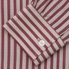 View 3 of product The Turnbull & Asser Burgundy Multi Stripe Weekend Fit Wool Shirt features a Derby collar, 1 button cuffs, and vertical red and white stripes, ideal for casual wear, shown against a white background.