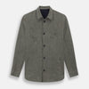 View 1 of product The Olive Linen Holland Shacket by Turnbull & Asser is a lightweight olive button-up jacket in Irish linen with a collar, two front pockets, one chest pocket, and slanted hem pockets—ideal outerwear shown on a plain white background.