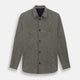 The Olive Linen Holland Shacket by Turnbull & Asser is a lightweight olive button-up jacket in Irish linen with a collar, two front pockets, one chest pocket, and slanted hem pockets—ideal outerwear shown on a plain white background.