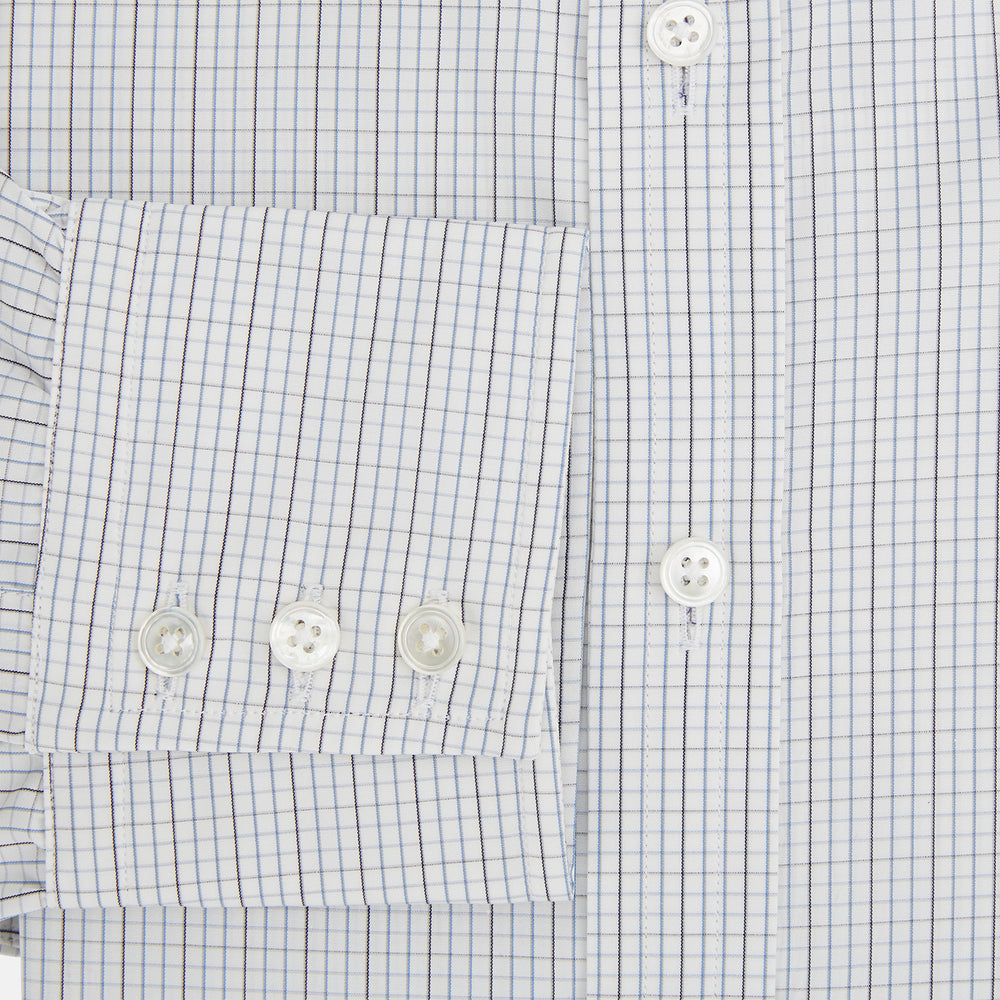 The Turnbull & Asser Pale Blue and Grey Grid Check Mayfair Shirt features long sleeves, a pointed collar, and buttoned cuffs. Crafted from Italian cotton, it displays a subtle grid pattern on a plain white background.