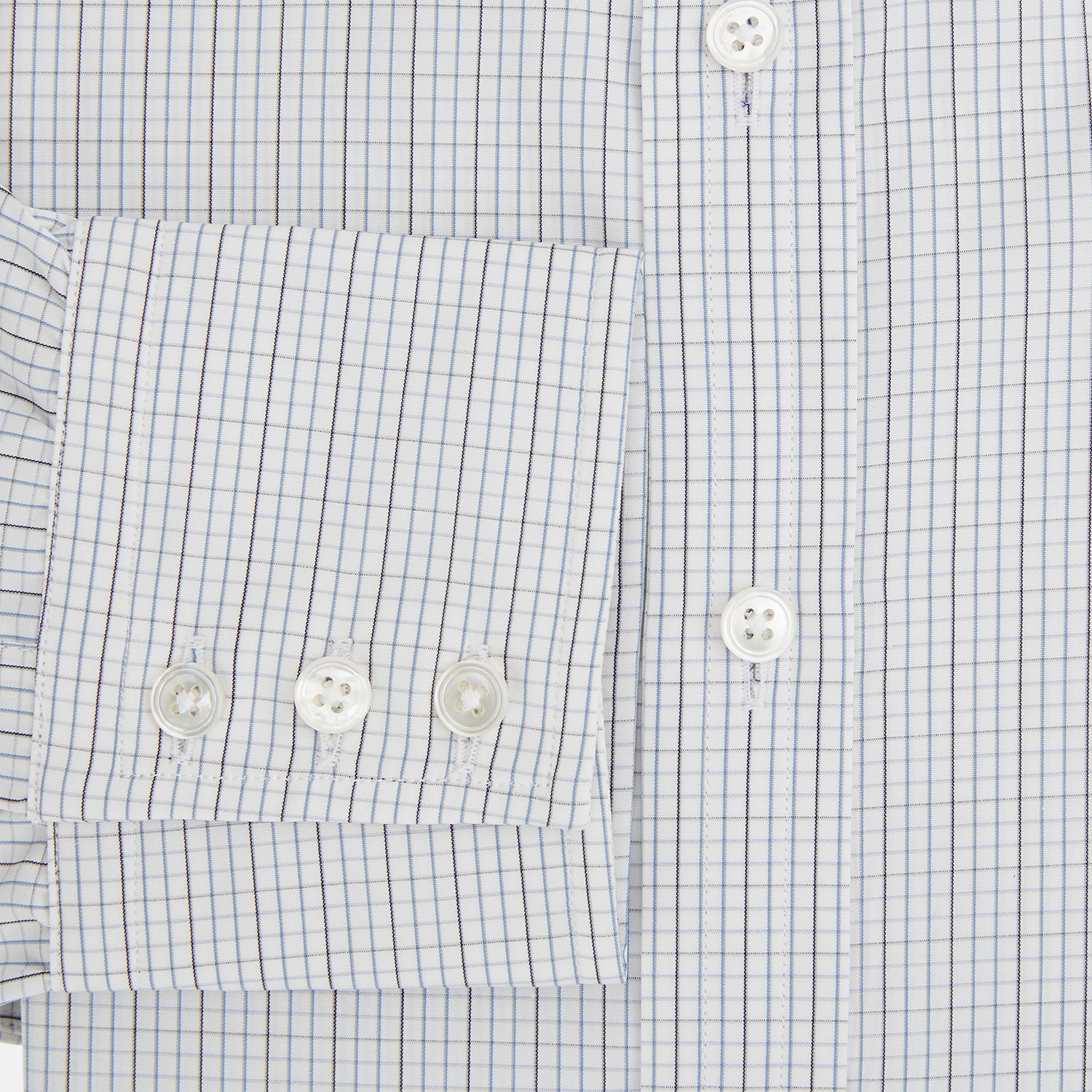 View 4 of product The Turnbull & Asser Pale Blue and Grey Grid Check Mayfair Shirt features long sleeves, a pointed collar, and buttoned cuffs. Crafted from Italian cotton, it displays a subtle grid pattern on a plain white background.