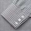 View 3 of product The Turnbull & Asser Grey Gingham Check Cotton Melange Regular Fit Mayfair Shirt, shown flat against a white background, offers a classic designer look with its small black and white check pattern and button-down design.