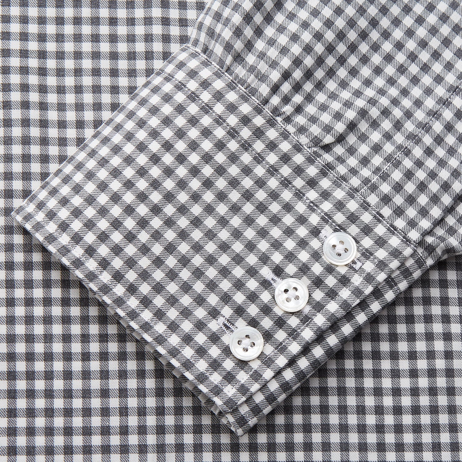 View 3 of product The Turnbull & Asser Grey Gingham Check Cotton Melange Regular Fit Mayfair Shirt, shown flat against a white background, offers a classic designer look with its small black and white check pattern and button-down design.