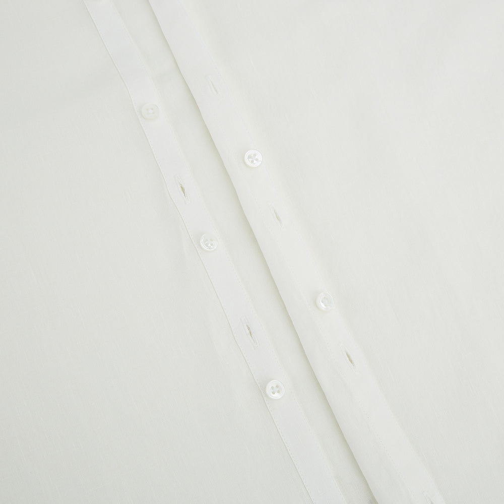 The Vanilla Linen Westminster Shirt by Turnbull & Asser is a long-sleeve, white button-up with a Turnbull collar, buttoned cuffs, and straight hem, highlighting British craftsmanship against a plain white background.