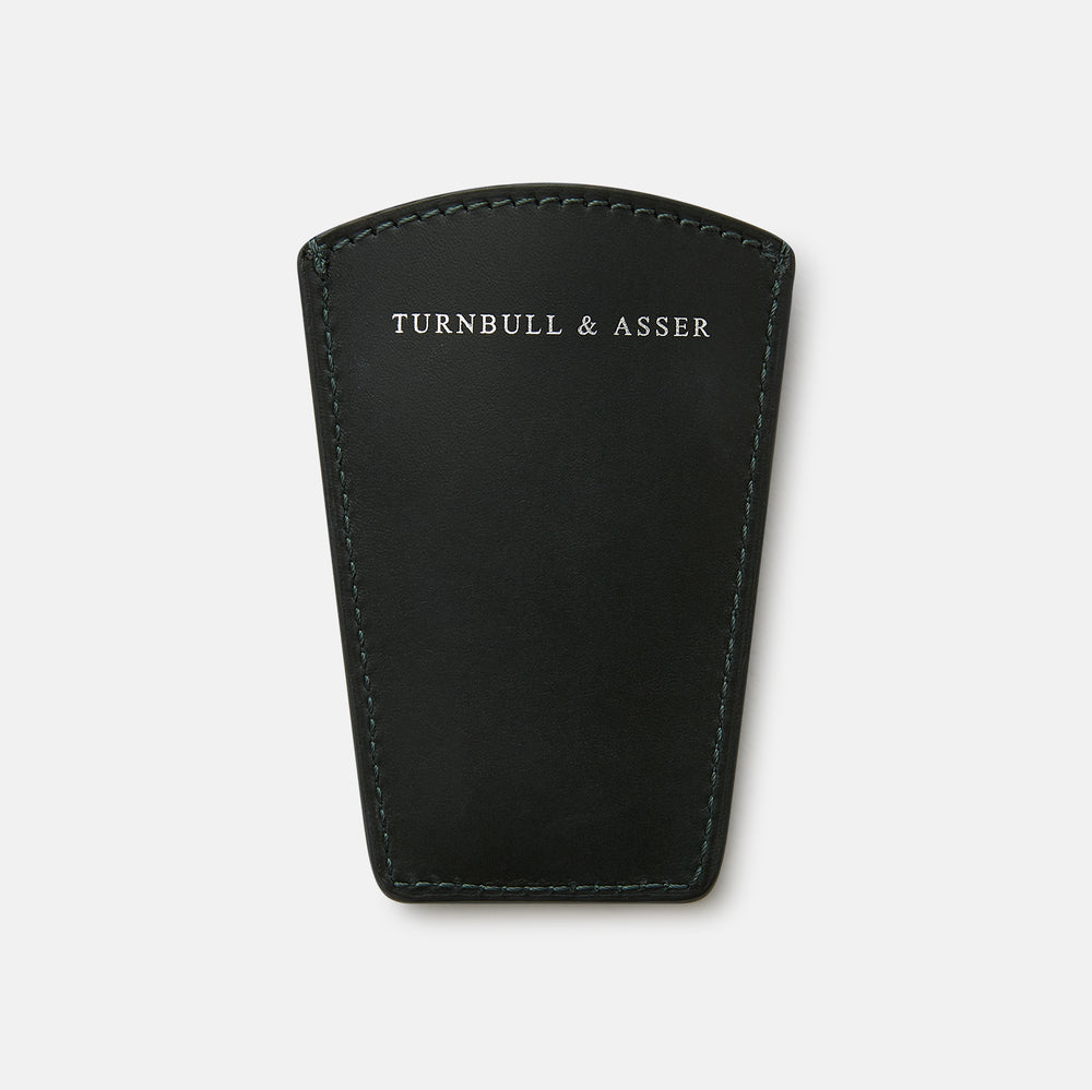 The Turnbull & Asser Forest Green Travel Shoe Horn features a wide, smooth metal blade and a forest green leather handle, shown against a plain white background.