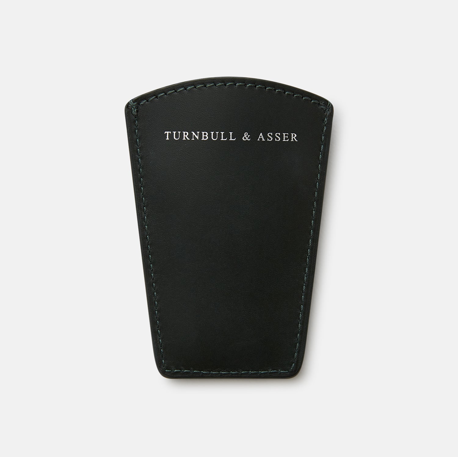 View 4 of product The Turnbull & Asser Forest Green Travel Shoe Horn features a wide, smooth metal blade and a forest green leather handle, shown against a plain white background.