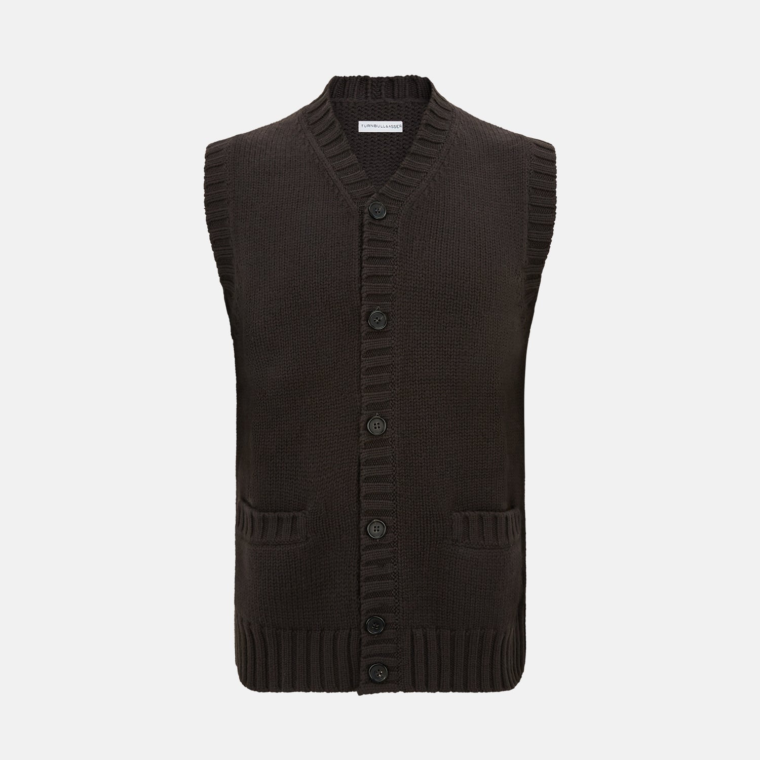 View 1 of product The Brown Merino V-Neck Sleeveless Cardigan by Turnbull & Asser features ribbed edges, front pockets, and a button-up front—ideal as an elegant light layer. Shown against a plain white background.
