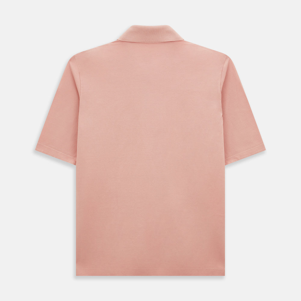 The Orange Polo Shirt by Turnbull & Asser features short sleeves, a collar, three-button placket, and a small buttoned chest pocket in soft cotton jersey—timeless men's style laid flat on a white background.