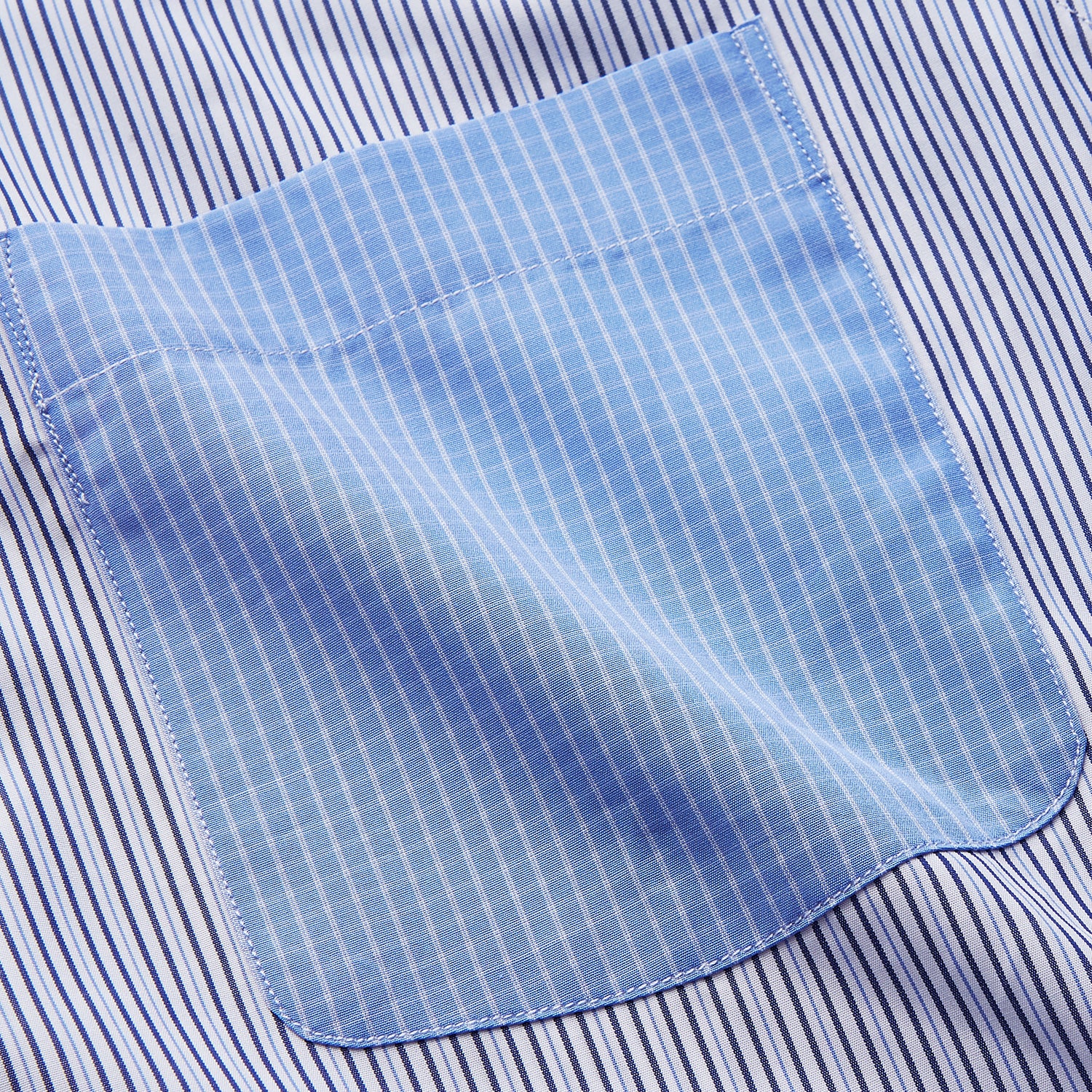 View 2 of product The Turnbull & Asser Blue Multi Stripe Cotton RE-PURPOSE Weekend Fit Finch Shirt features thin blue and white stripes, a contrasting light blue checkered chest pocket, and is crafted sustainably using recycled fabrics.