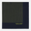 View 4 of product Turnbull & Asser Navy and Yellow Stripe Silk Pocket Square features hand-rolled edges, striped pattern, and "Turnbull & Asser Hand Printed in England" text in yellow on the bottom right corner.