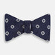 The Navy and White Motif Silk Bow Tie by Turnbull & Asser features a geometric floral pattern, adding refined elegance to formalwear. Shown on a plain white background.