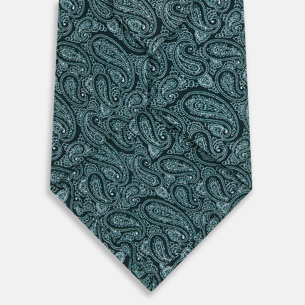 The Turnbull & Asser Light Petrol Paisley Silk Tie features a light petrol teal base with an elegant paisley pattern.