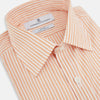 View 2 of product The Turnbull & Asser Orange Ticking Stripe Mayfair Shirt features thin vertical stripes, a classic T&A collar, and buttoned cuffs, shown on a plain white background.