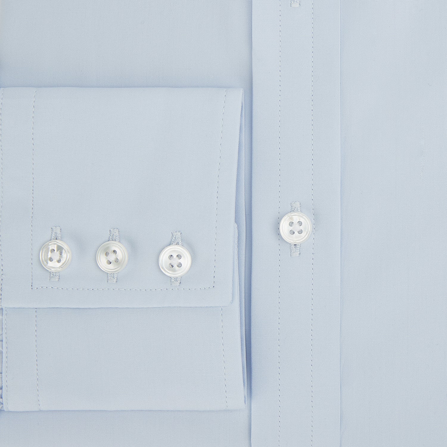 View 4 of product The Turnbull & Asser PALE BLUE COTTON REGULAR FIT MAYFAIR SHIRT is a long-sleeve, button-down shirt with a pointed T&A collar, shown laid flat on a white background.