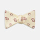 The Yellow Geometric Rings Silk Bow Tie by Turnbull & Asser features interlocking rings in a bold geometric pattern, crafted from silk.