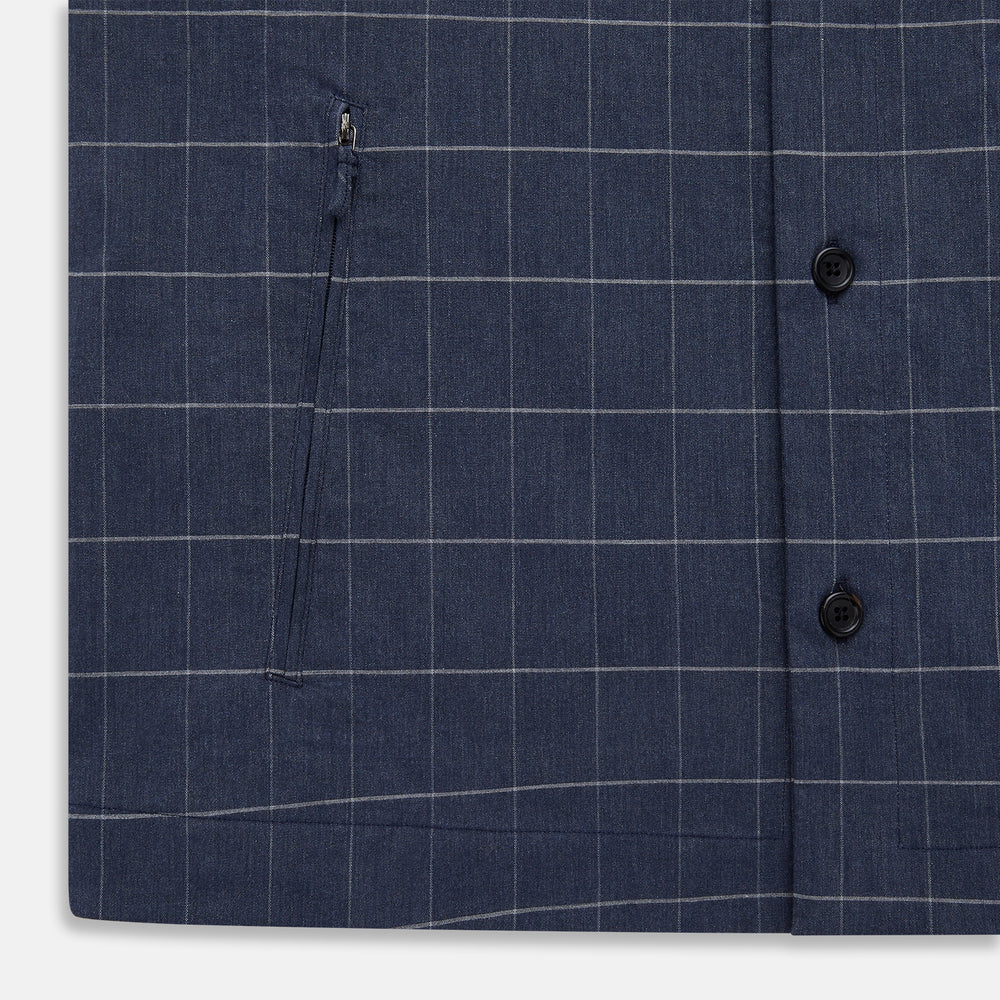 The Turnbull & Asser Royal Blue Check Hampstead Overshirt features a white windowpane pattern, long sleeves, two front pockets, and a chest pocket, displayed on a plain white background for an elegant classic look.