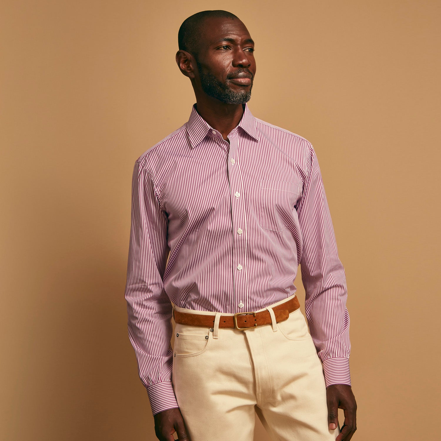View 2 of product The Turnbull & Asser Purple & White Stripe Weekend Fit Shirt features a Derby collar, chest pocket, and 1-button cuffs—ideal for casual weekends.
