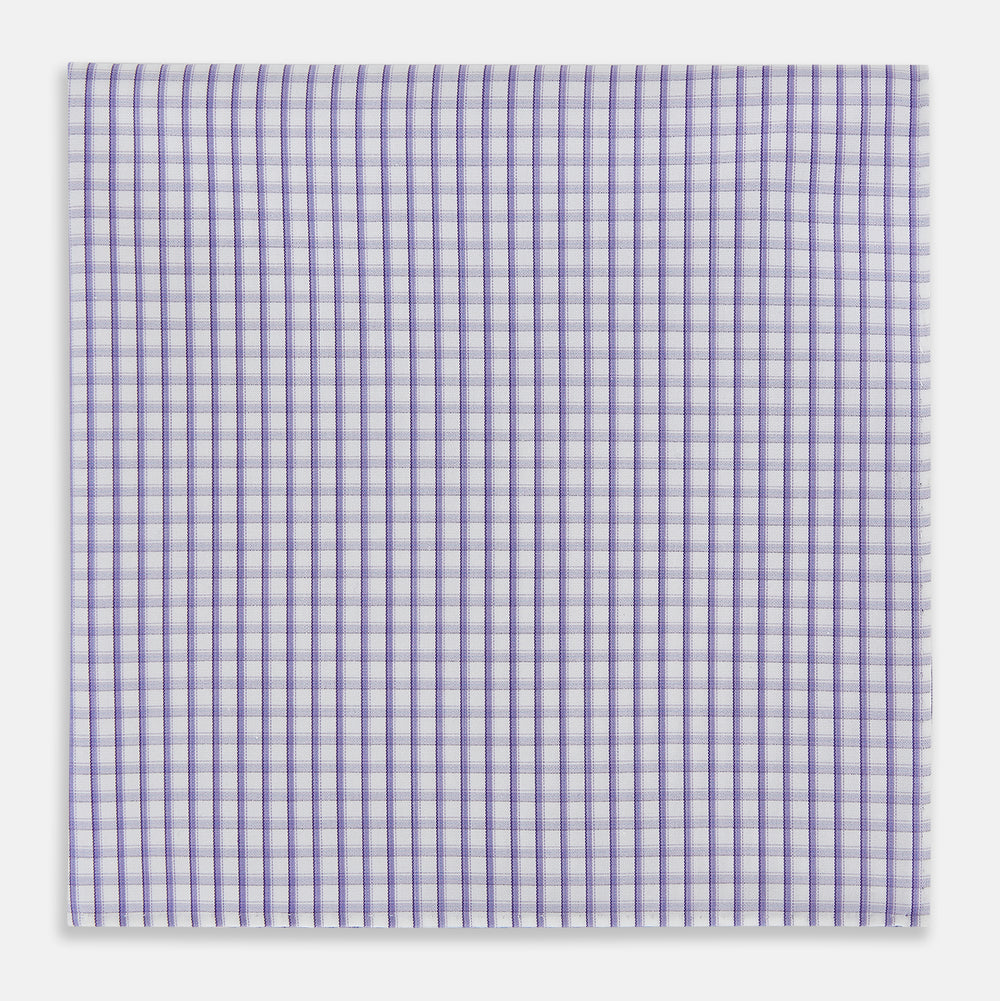 The Turnbull & Asser Purple Micro Shadow Check Hand-Rolled Handkerchief, crafted in England, features a checkered purple and white pattern with fine hand-rolled edges.