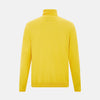 View 3 of product The Turnbull & Asser Canary Yellow Fine Merino High Neck Jumper features soft merino wool, long sleeves, and a classic turtleneck design, presented on a plain white background.