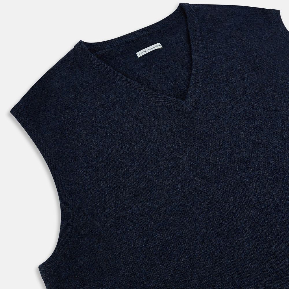 The Turnbull & Asser Navy Melange V-neck Cashmere Vest is a sleeveless jumper with a classic, pattern-free design, showcased against a plain white background for an elegant and timeless look.