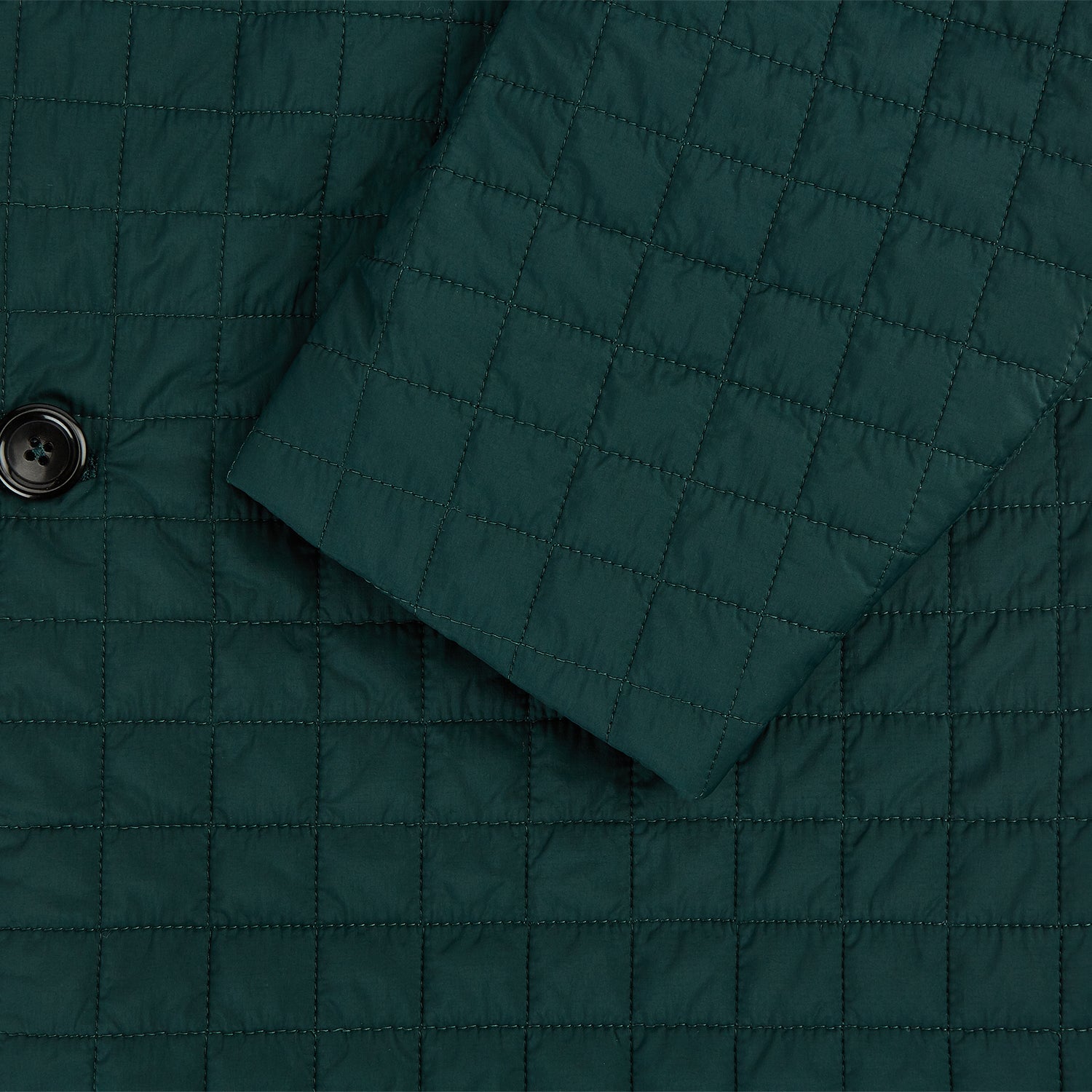 View 4 of product The Turnbull & Asser Fulham Forest Green Single-Breasted Quilted Blazer features a three-button front, notched lapels, chest pocket, and two front flap pockets—an elegant choice for the modern gentleman on a plain white background.