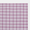 View 2 of product The Turnbull & Asser Hand Rolled Purple Graph Overlay Check Handkerchief is a white cotton accessory featuring intersecting purple and pink lines that create evenly spaced squares across the fabric.