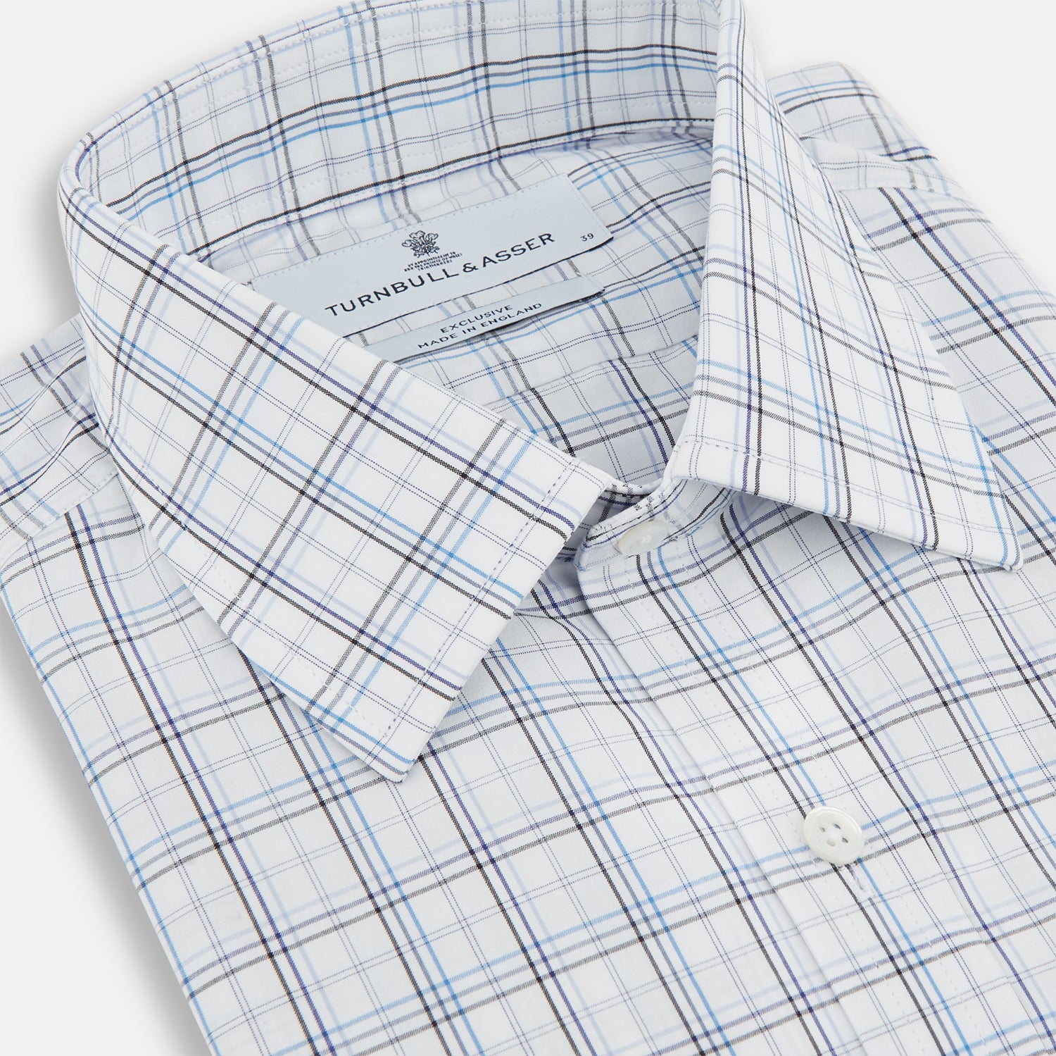 View 2 of product The Turnbull & Asser Purple and Blue Multi Check Mayfair Shirt features long sleeves, a button-up front, and a classic T&A collar, with blue and light gray checks on white, displayed flat against a plain white background.