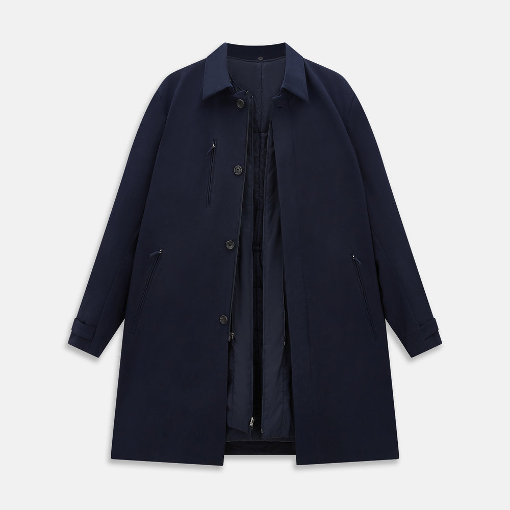 A Navy John Arthur Trench Coat by Turnbull & Asser, featuring a collar, button closure, adjustable cuff straps, two slanted front pockets, and a chest zip pocket, is displayed flat on a white background.